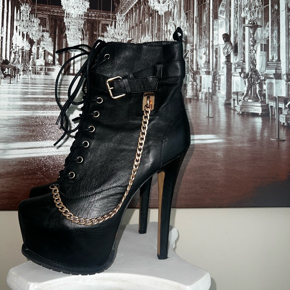 Zigi Girl Leather black skate lace up boots with rose gold tone chain accent,